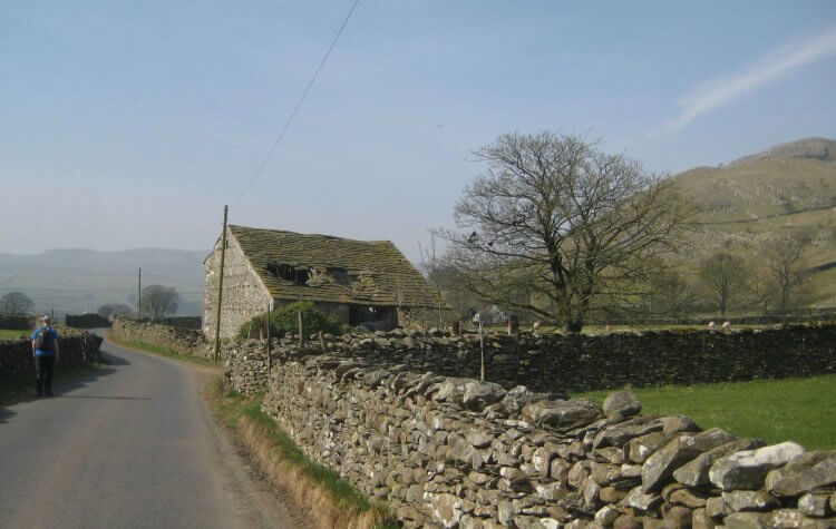 Horton - Quiet road from Helwith Village passing an old farm building Quiet road from Helwith Village passing an old farm building