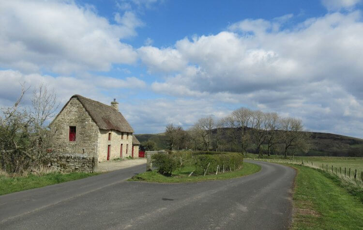 Passing a thatched cottage on Stanegate Road on the way to Vindolanda.