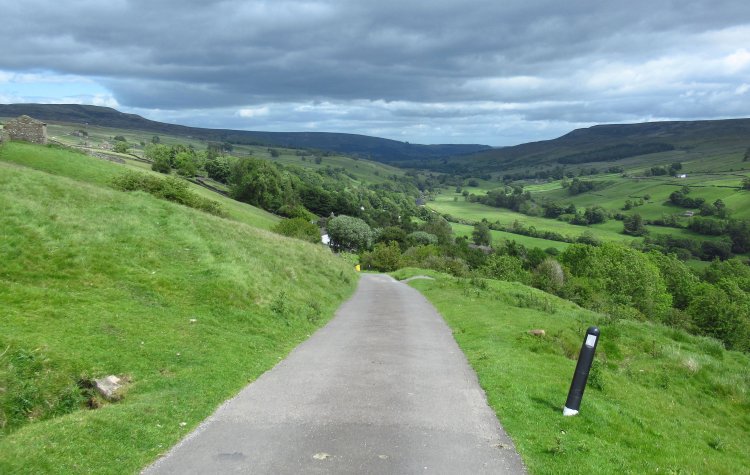 Feetham - Coast to Coast path on a minor road in Swaledale Coast to Coast path on a minor road in Swaledale
