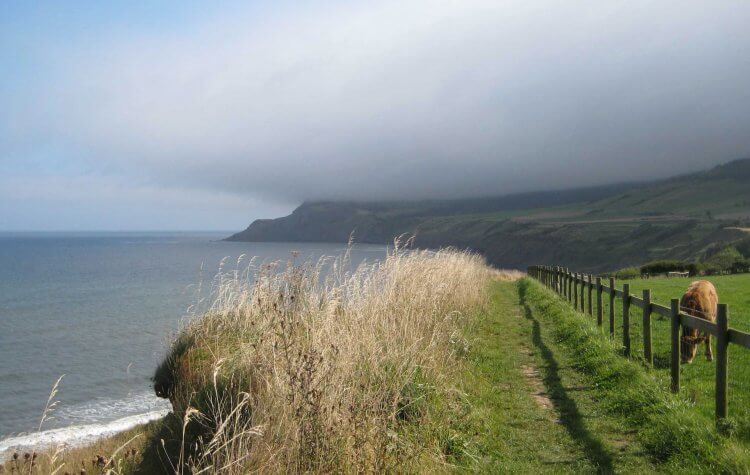 Path along the cliff tops and the mist rolling in